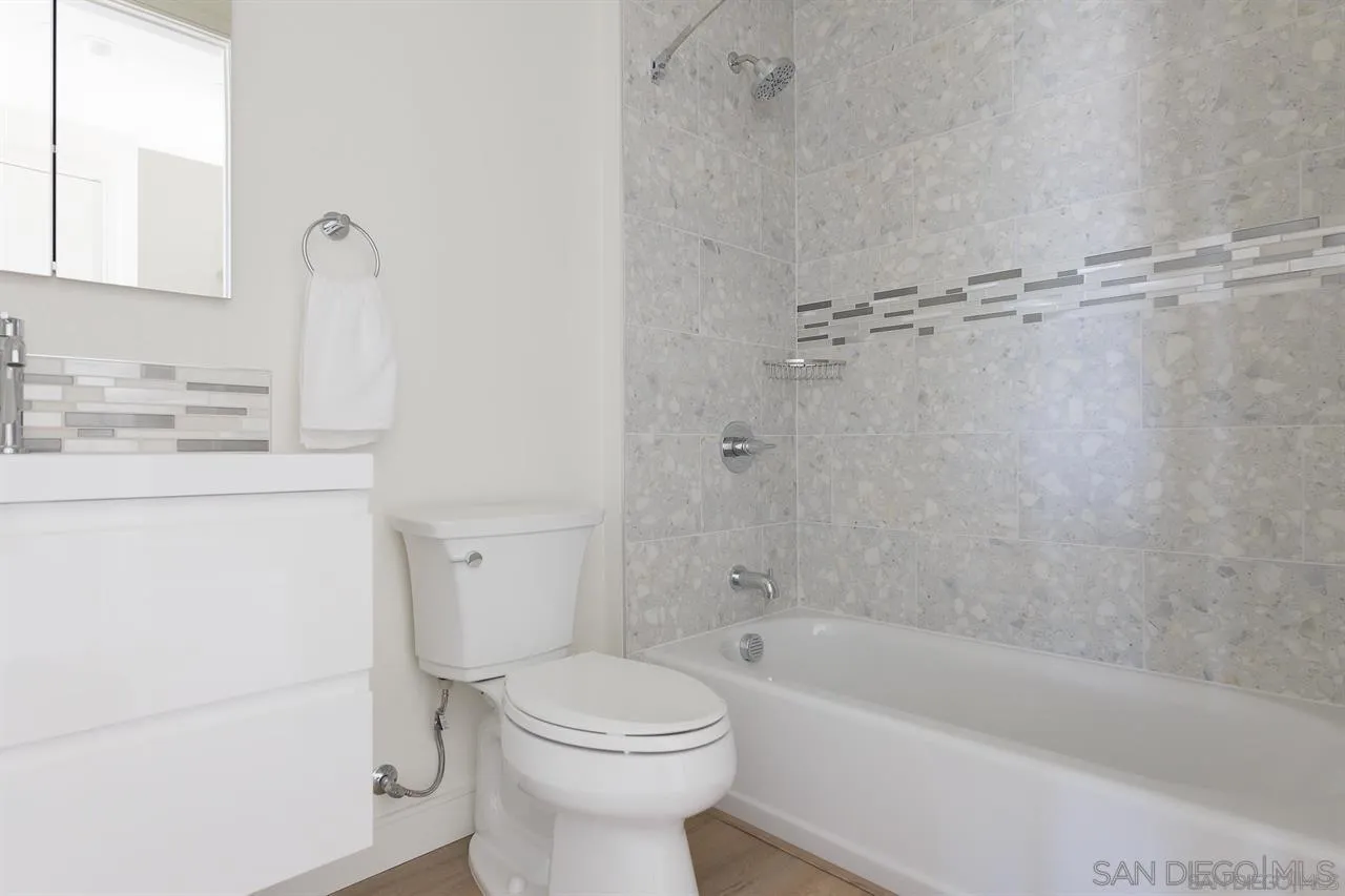 8292 High Street La Mesa, CA 91941 - Photo 8 of 23 a bathroom with a sink a toilet and bathtub