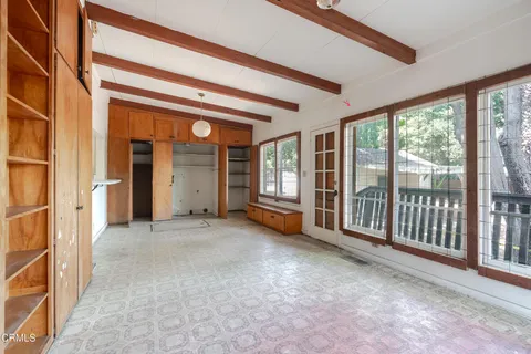 a view of a room with large windows