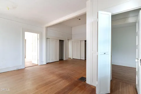 a view of entryway with wooden floor
