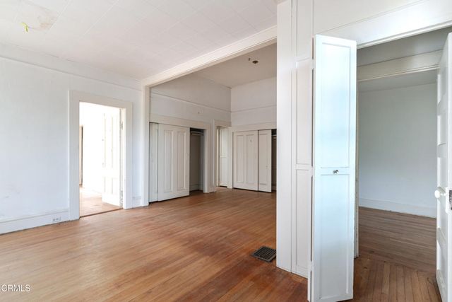 a view of entryway with wooden floor