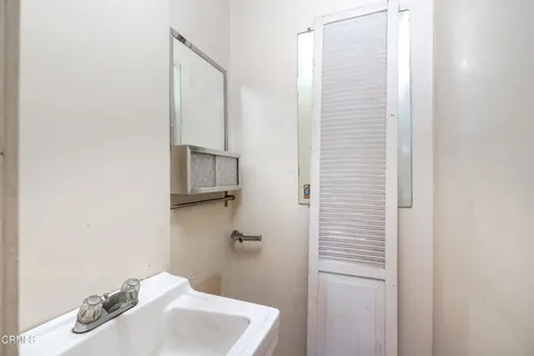 a bathroom with a sink and toilet