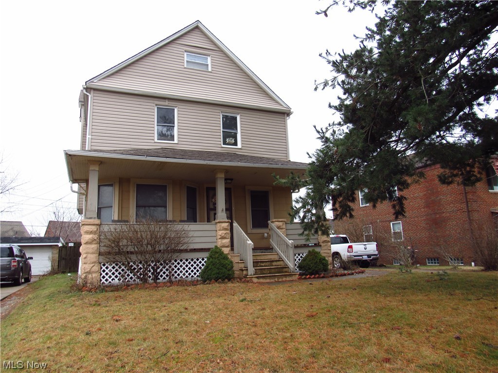6311 Ridge Road Parma, OH 44129 - Photo 5 of 26 View of front of property featuring a porch and a front yard