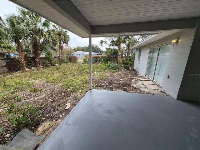 a view of backyard with green space