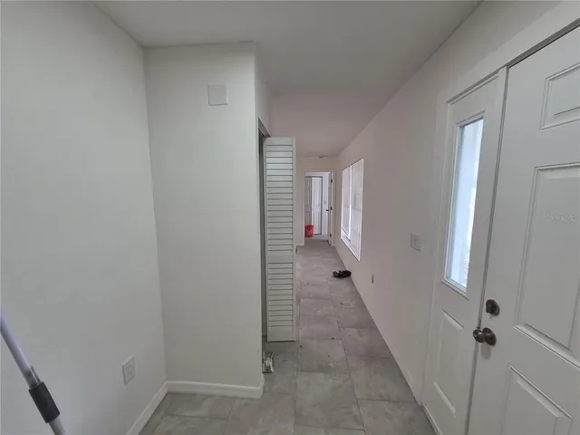 a view of a room with a hallway