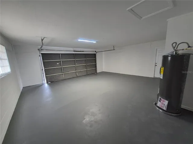 a view of an empty room with a fireplace