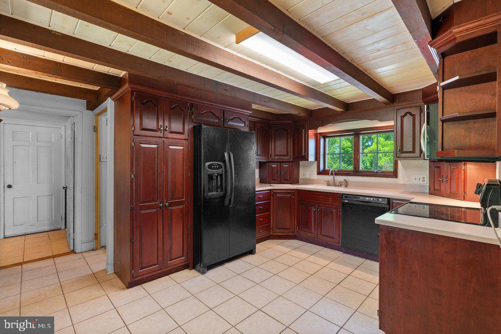 201 East Moyer Road Pottstown, PA 19464 - Photo 20 of 64 a kitchen with stainless steel appliances kitchen island granite countertop a refrigerator and a stove top oven