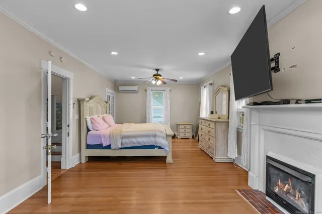 a bedroom with furniture and a fireplace