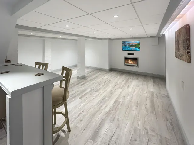 a view of work space with furniture and wooden floor