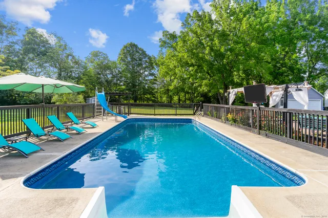 a view of a swimming pool with a lounge chairs