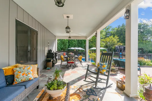 a view of a dining room with furniture water view and a large window