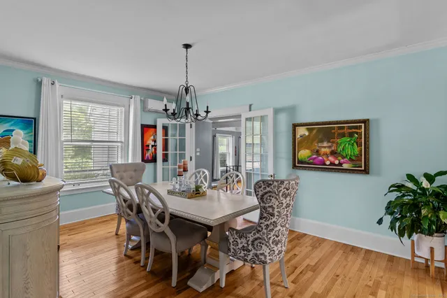 a view of a dining room with furniture window and wooden floor