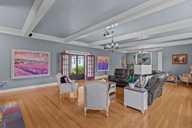a living room with fireplace furniture and a flat screen tv
