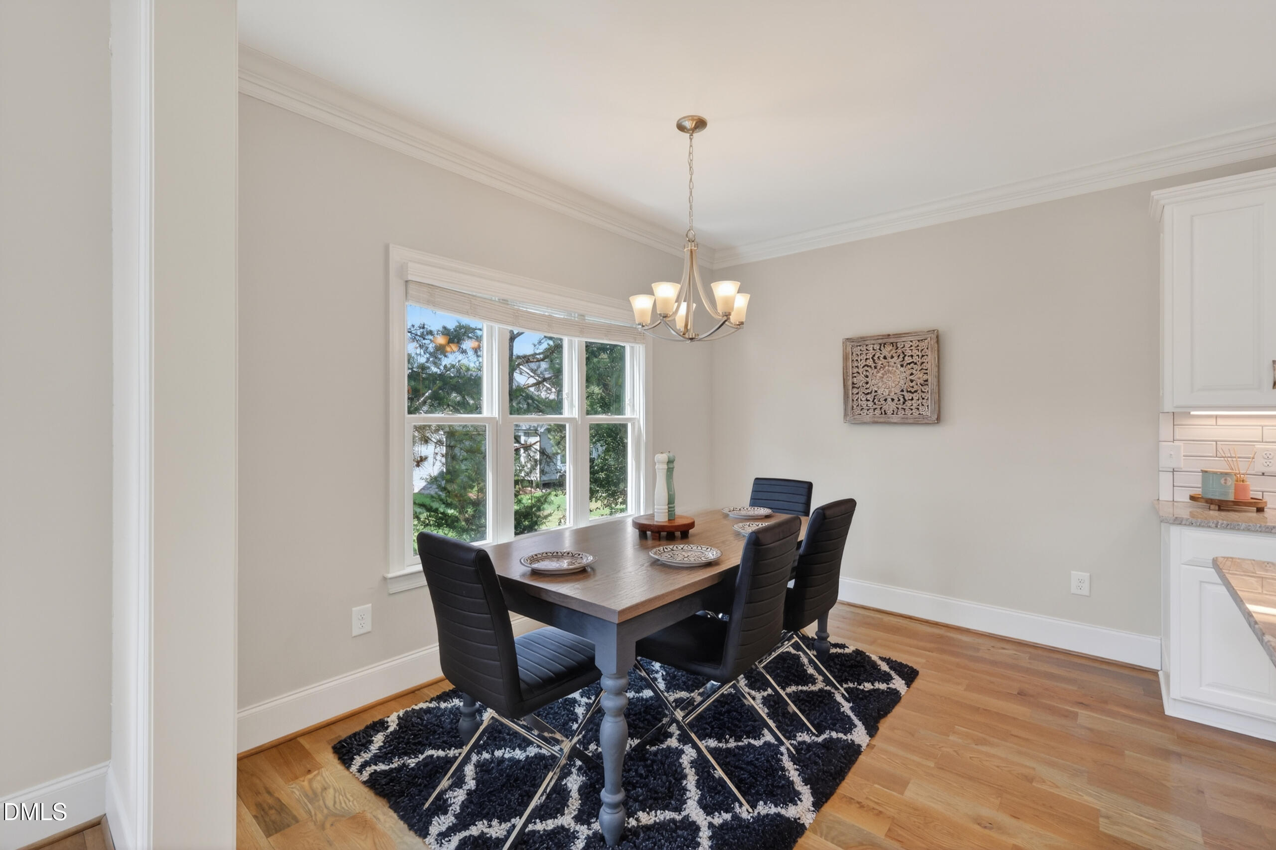 261 Character Drive Rolesville, NC 27571 - Photo 25 of 77 a view of a dining room with furniture window and wooden floor