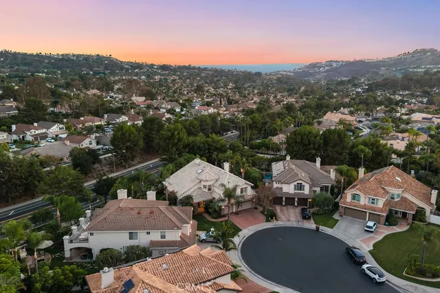 an aerial view of residential houses and outdoor space