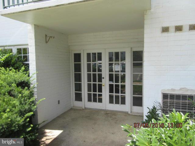 7095 Spring Garden Drive, Unit 3 Springfield, VA 22150 - Photo 2 of 6 a front view of a house with a plants