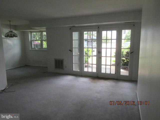 7095 Spring Garden Drive, Unit 3 Springfield, VA 22150 - Photo 3 of 6 a view of an empty room with a window