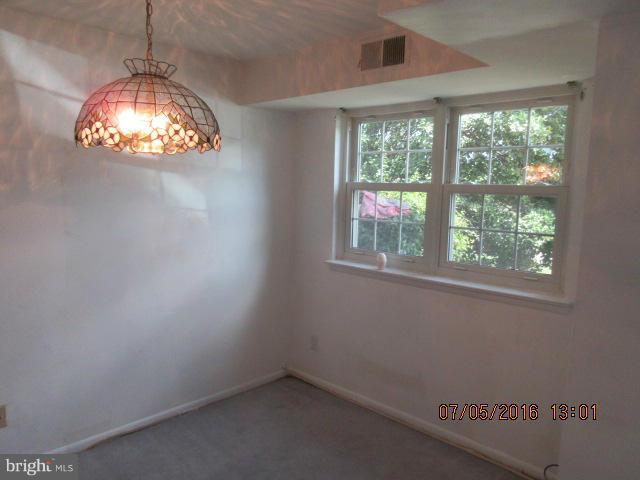7095 Spring Garden Drive, Unit 3 Springfield, VA 22150 - Photo 4 of 6 an empty room with a window