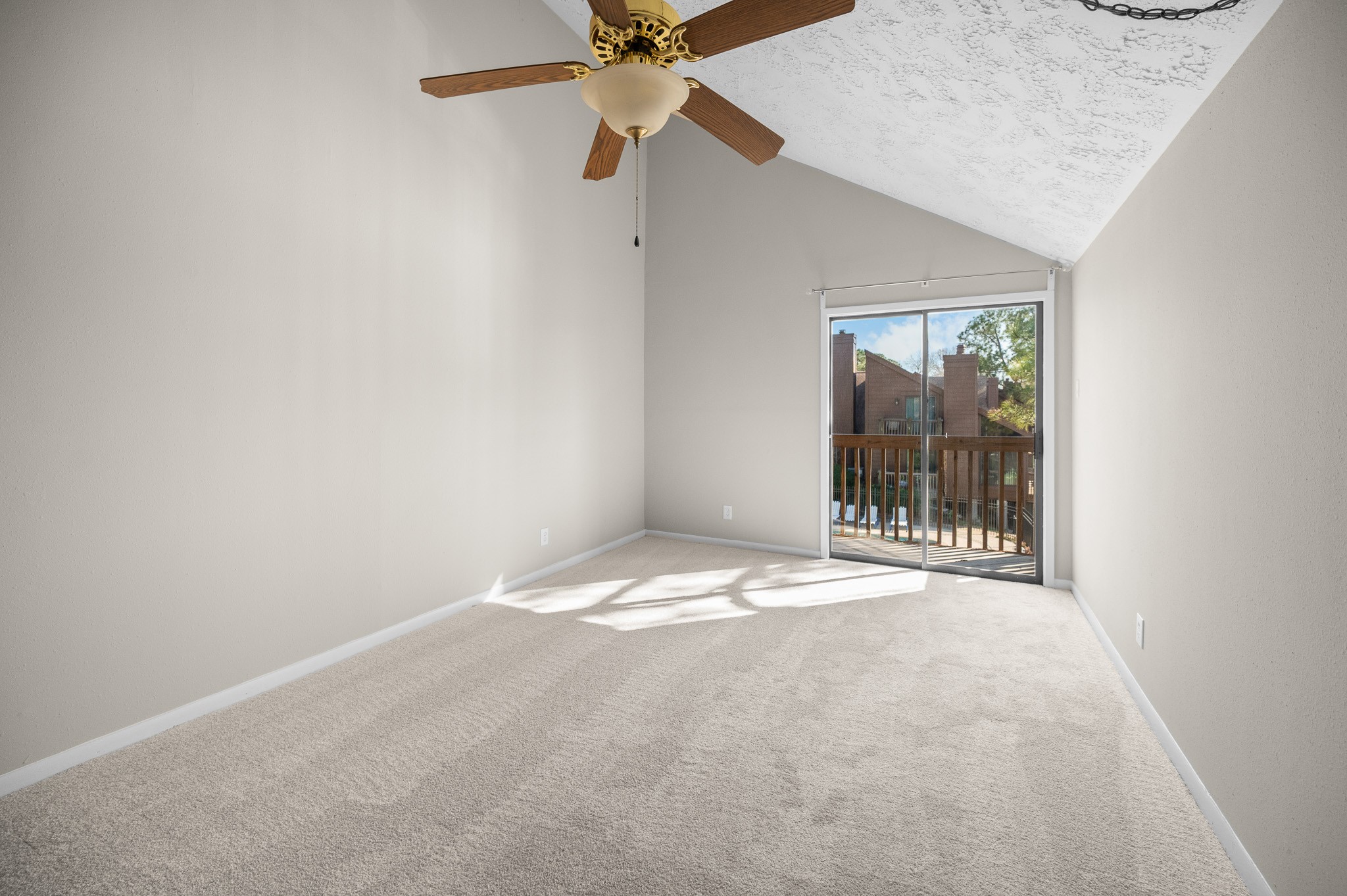 705 Davis Road League City, TX 77573 - Photo 11 of 26 Primary bedroom with new carpeting and access to the balcony area for your morning coffee.