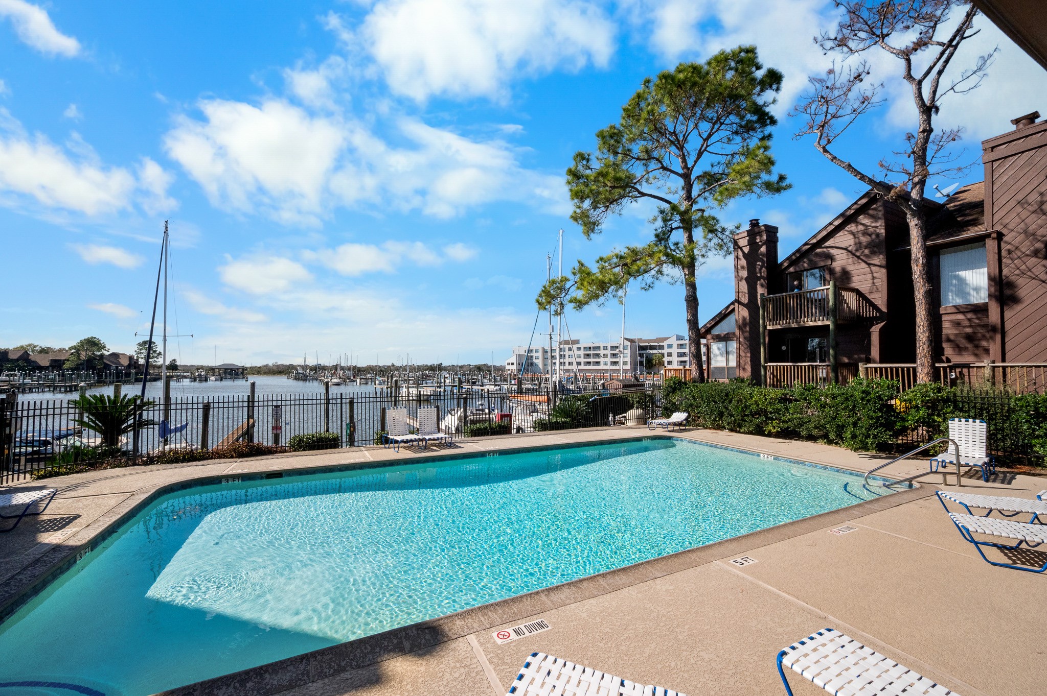 705 Davis Road League City, TX 77573 - Photo 21 of 26 Enjoy access to a private marina on Clear Lake, two waterfront pools, & newly resurfaced tennis courts with pickleball lines.