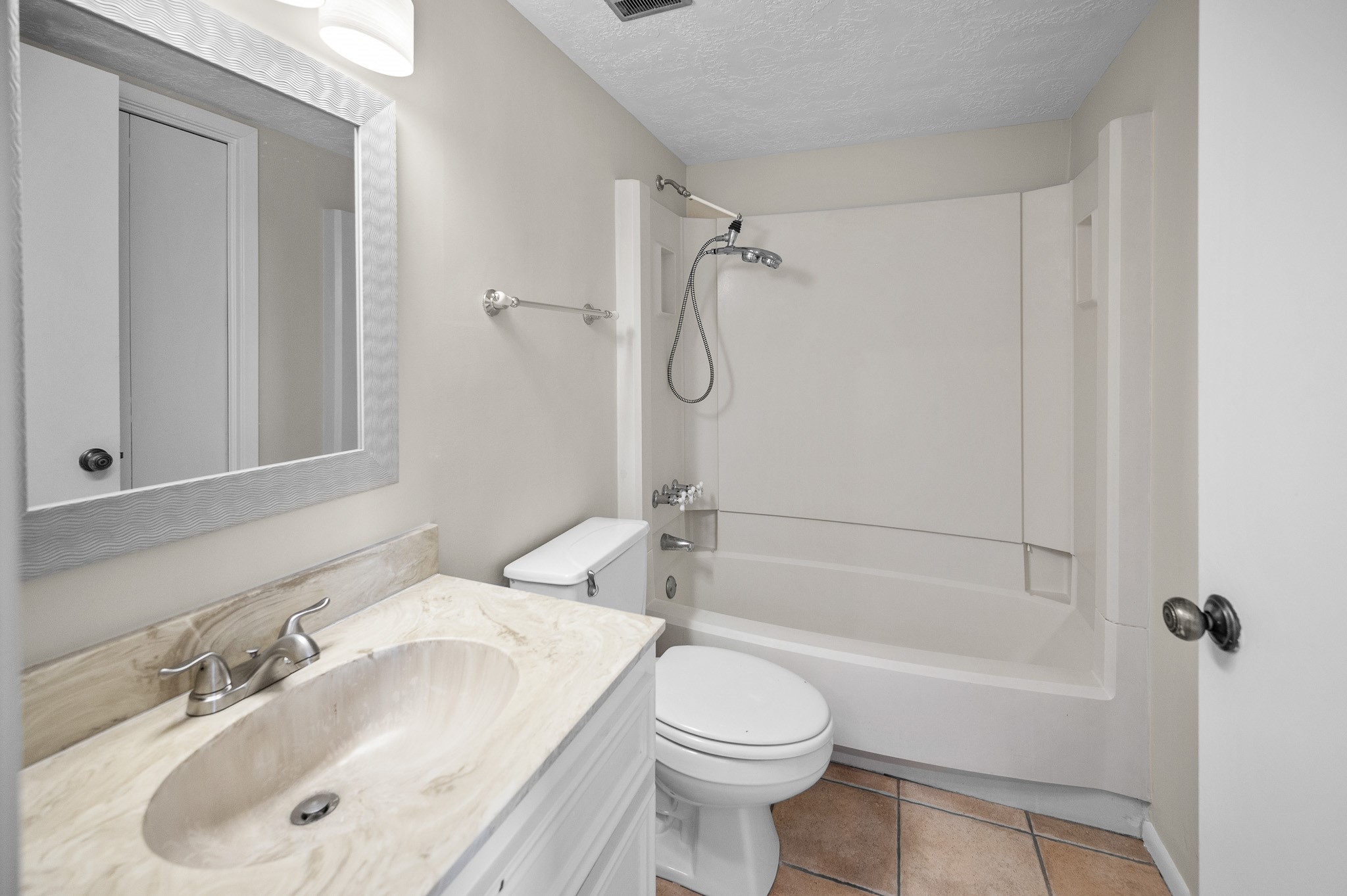 705 Davis Road League City, TX 77573 - Photo 10 of 26 Bathroom with a tub/shower combo and tons of storage space.