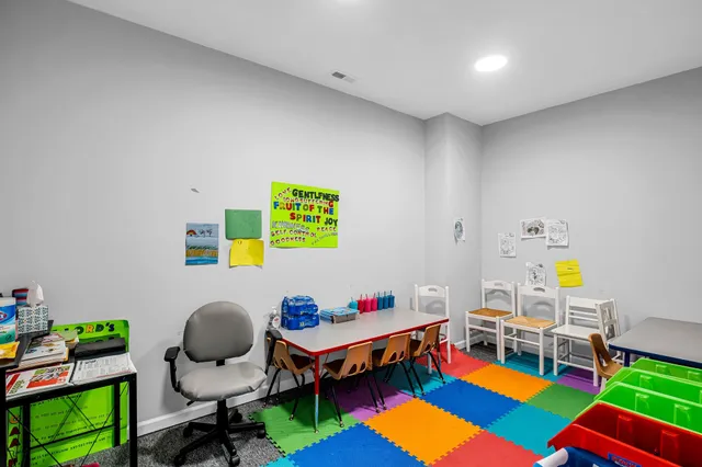 a living room with furniture and a dining area