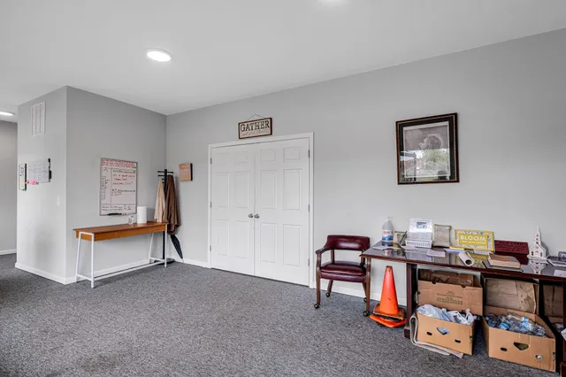 a view of a workspace with furniture