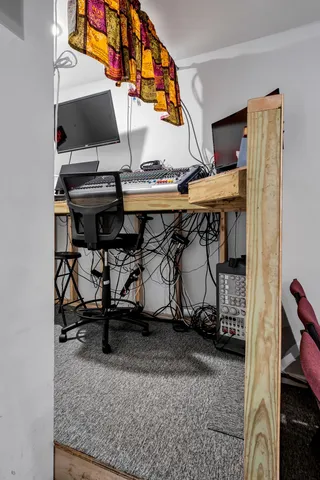 a view of gym equipment and a living room