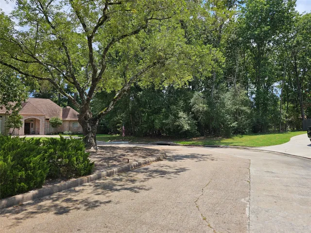 a view of outdoor space with playground and green space