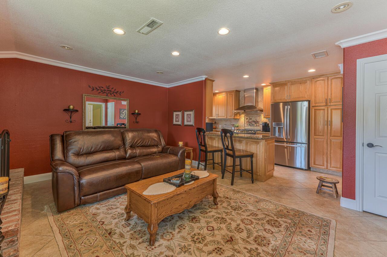 1239 Ayer Drive Gilroy, CA 95020 - Photo 13 of 39 a living room with furniture and kitchen view