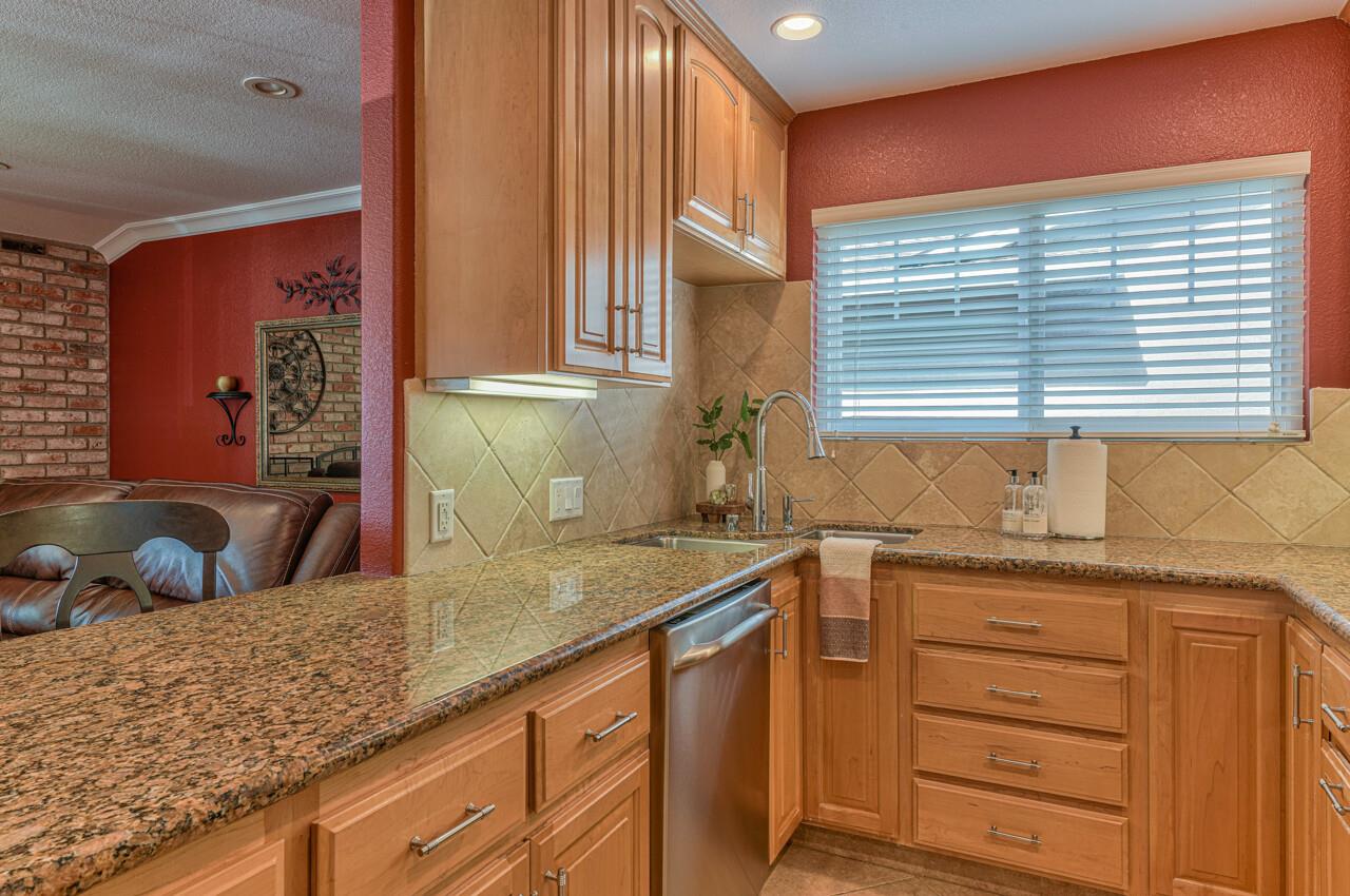 1239 Ayer Drive Gilroy, CA 95020 - Photo 15 of 39 a kitchen with granite countertop a sink a window and counter space