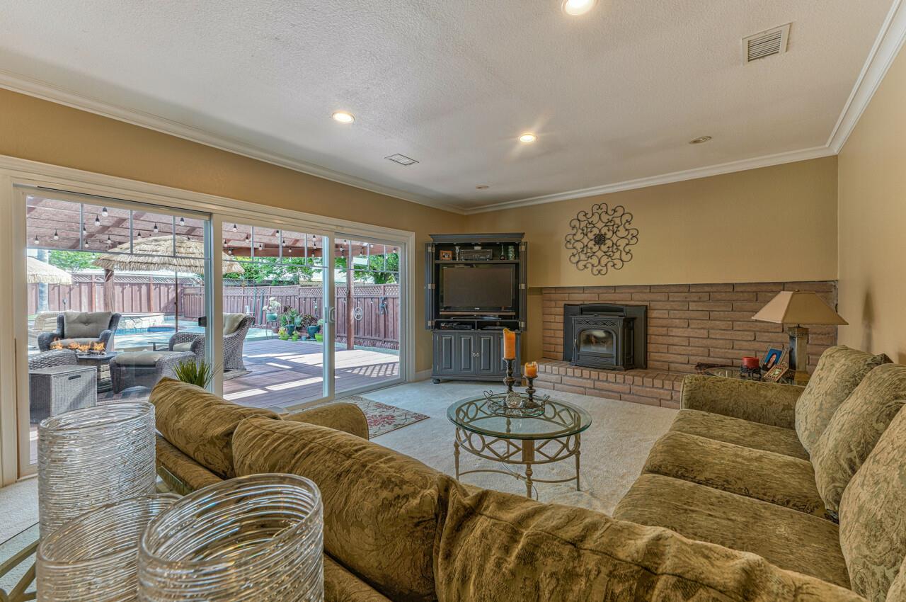1239 Ayer Drive Gilroy, CA 95020 - Photo 20 of 39 a living room with furniture and a fireplace