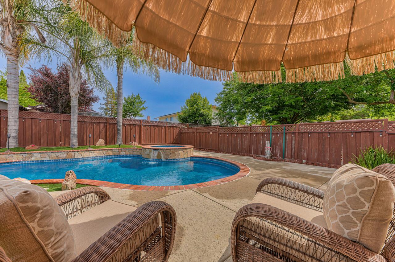 1239 Ayer Drive Gilroy, CA 95020 - Photo 25 of 39 a view of a backyard with swimming pool