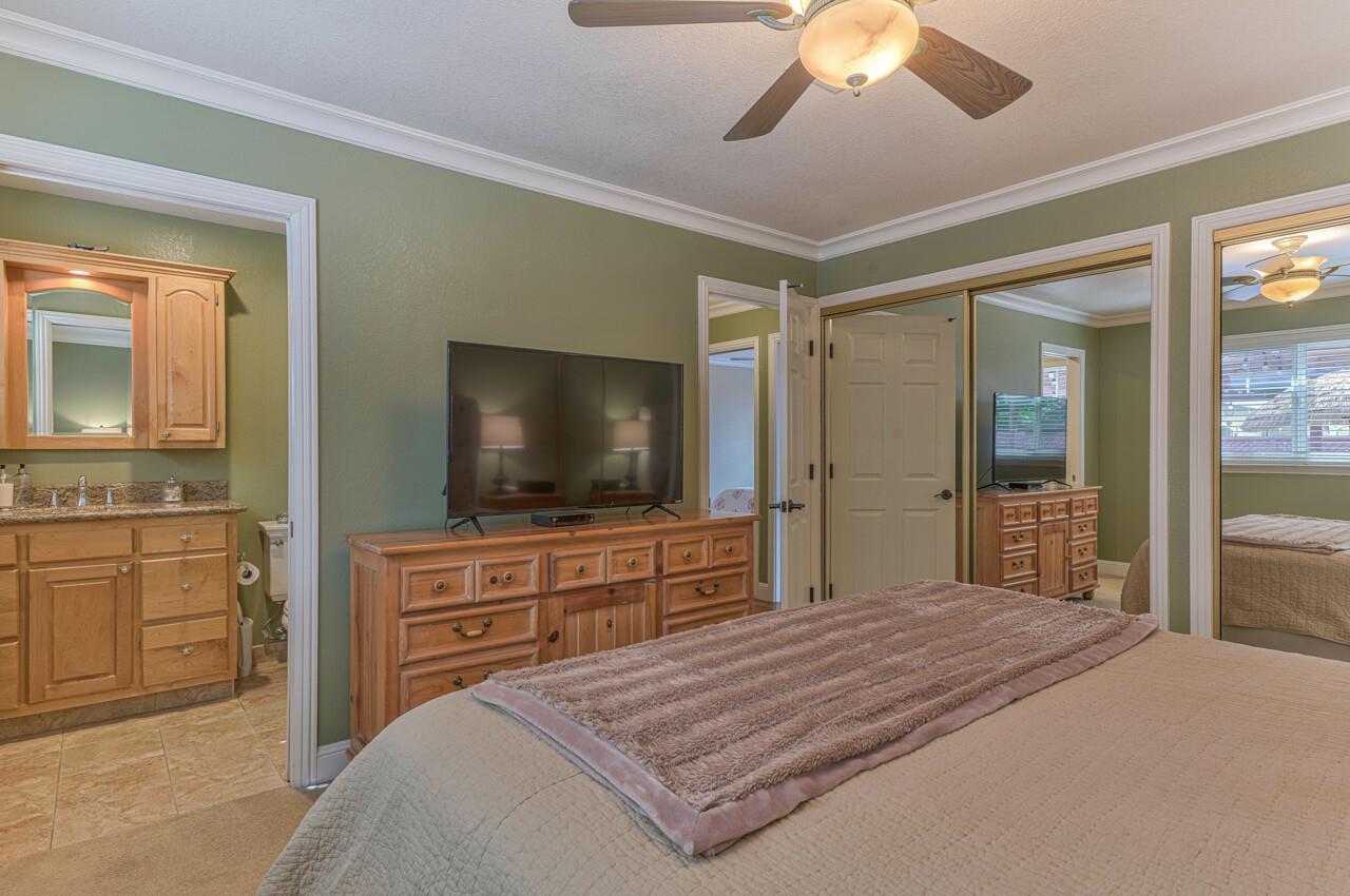 1239 Ayer Drive Gilroy, CA 95020 - Photo 28 of 39 a bedroom with a bed and a flat screen tv in it