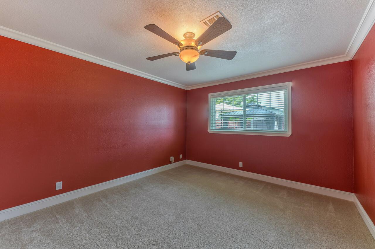 1239 Ayer Drive Gilroy, CA 95020 - Photo 32 of 39 an empty room with window and ceiling fan