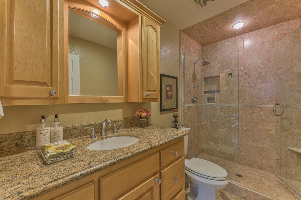 1239 Ayer Drive Gilroy, CA 95020 - Photo 34 of 39 a bathroom with a granite countertop sink toilet and shower