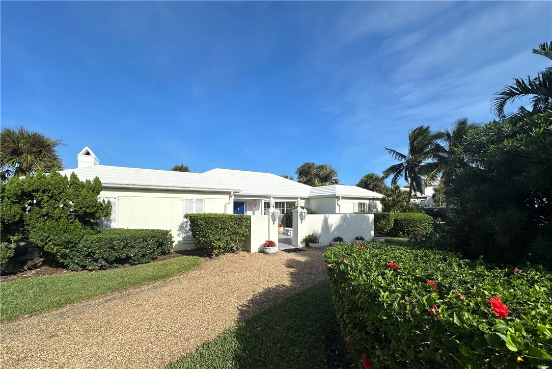 935 Reef Road Vero Beach, FL 32963 - Photo 3 of 4 a front view of a house with a yard