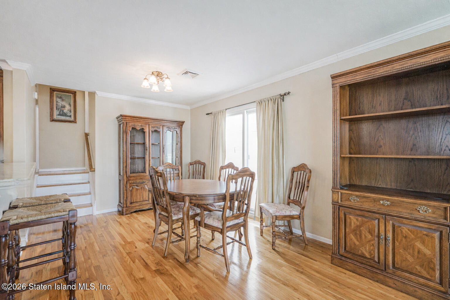 76 Berry Avenue Staten Island, NY 10312 - Photo 6 of 42 a view of a dining room with furniture window and wooden floor