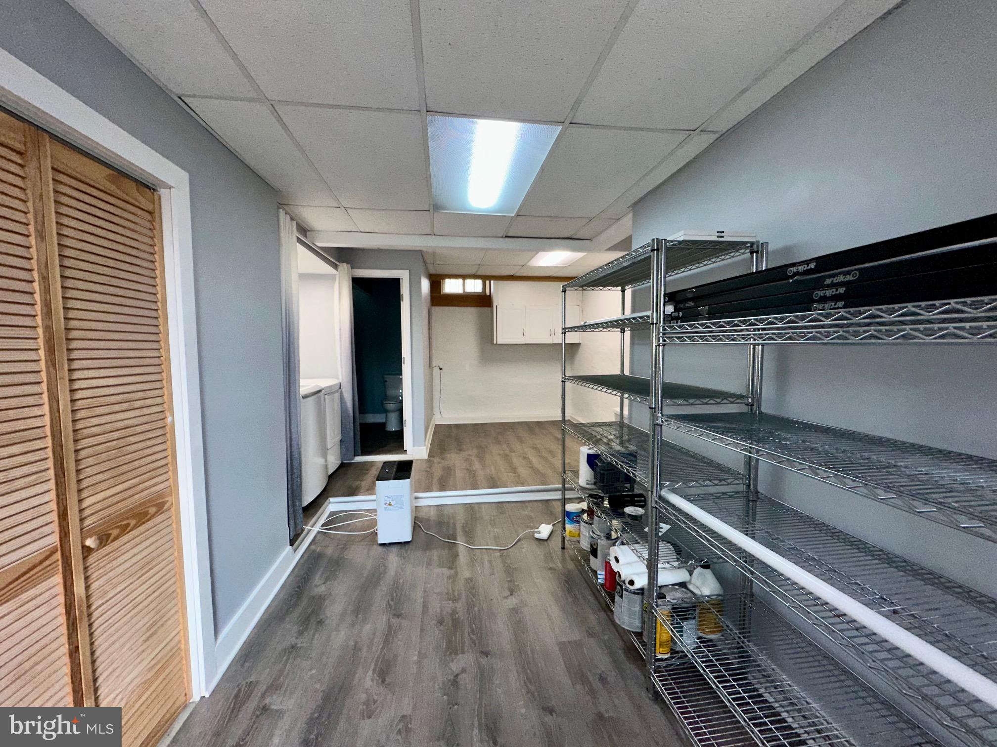 3922 Manor Street Philadelphia, PA 19128 - Photo 20 of 30 a view of a hallway with wooden floor and staircase