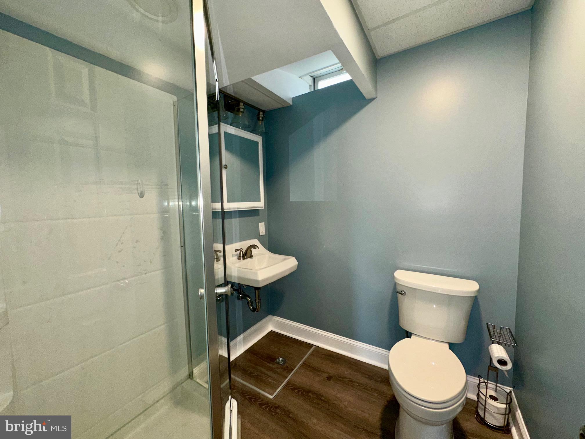 3922 Manor Street Philadelphia, PA 19128 - Photo 21 of 30 a white toilet sitting next to a bathroom sink