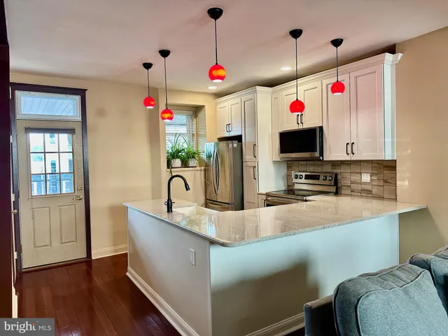 a very nice looking room with kitchen furniture