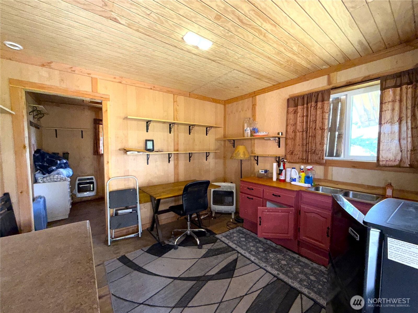 19 Union Ridge Spur Road Republic, WA 99166 - Photo 7 of 33 a work room with furniture a rug and a chandelier