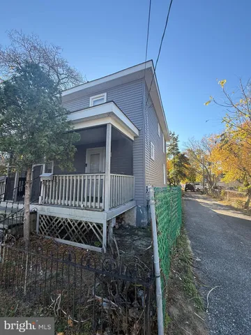 a view of backyard with deck and garden