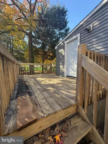 a view of a backyard with wooden fence