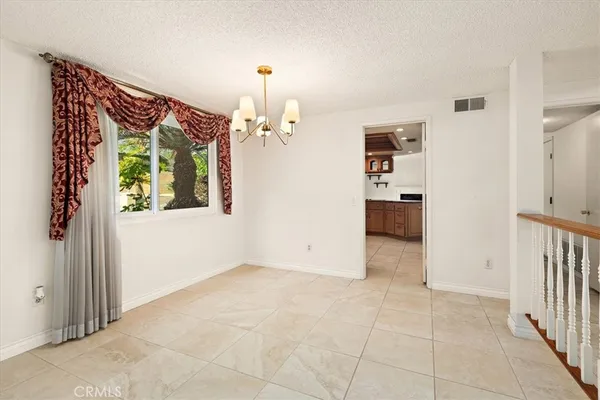 a kitchen with cabinets a sink and appliances