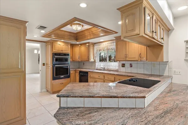 a view of a kitchen with granite countertop a sink