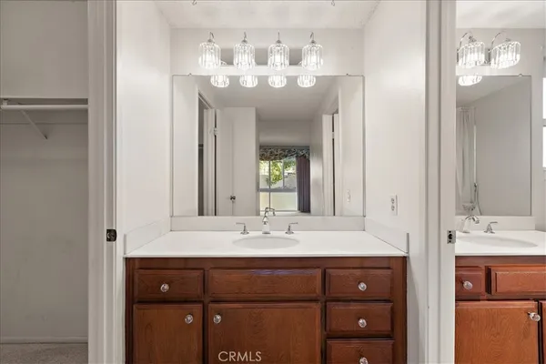 a bathroom with a granite countertop shower