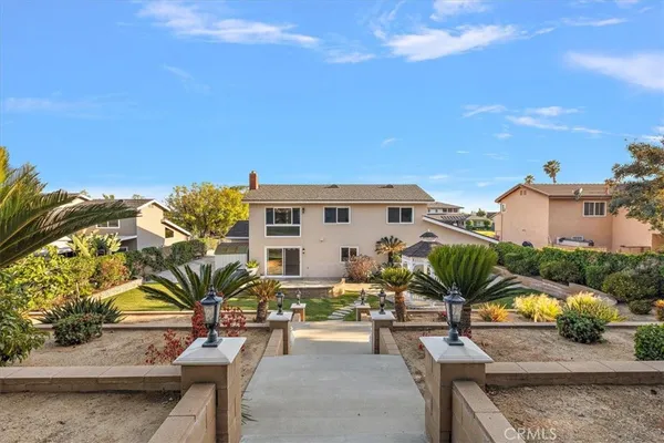 a view of a swimming pool with lounge chair