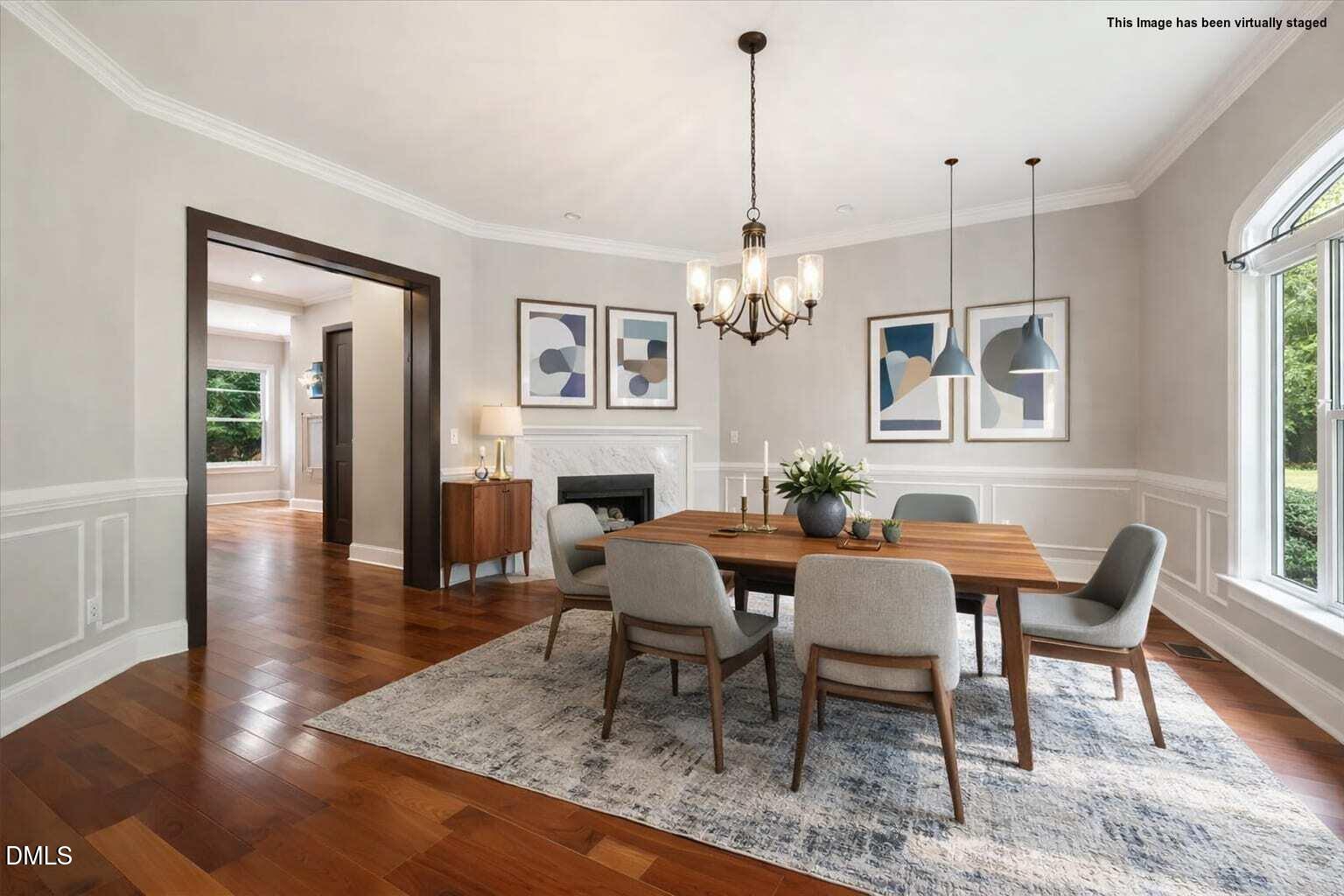 6300 Swallow Cove Lane Raleigh, NC 27614 - Photo 7 of 67 a dining room with furniture a chandelier and wooden floor