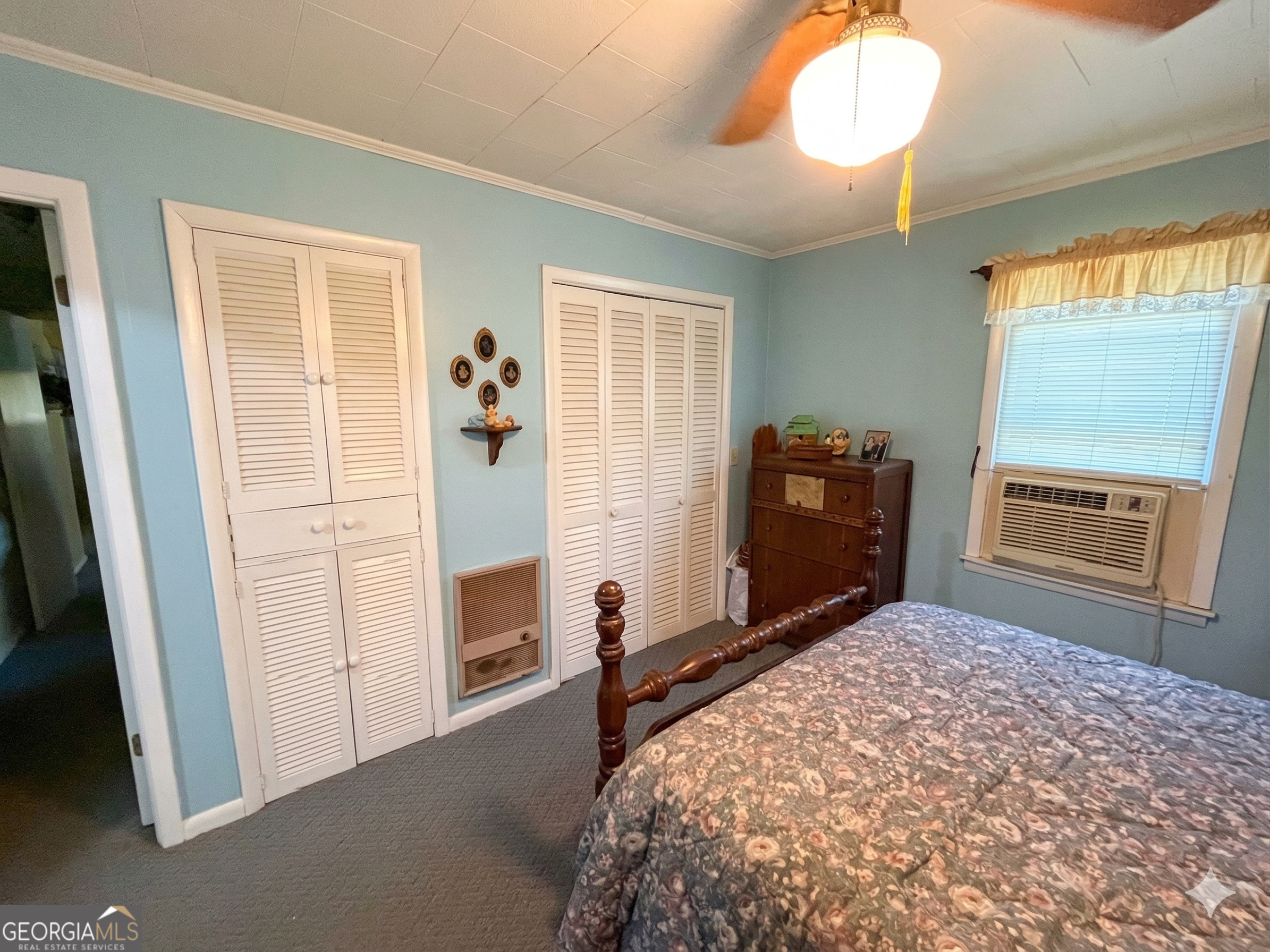 32737 Highway 48 Graham, AL 36263 - Photo 17 of 69 a bedroom with a bed and wooden floor