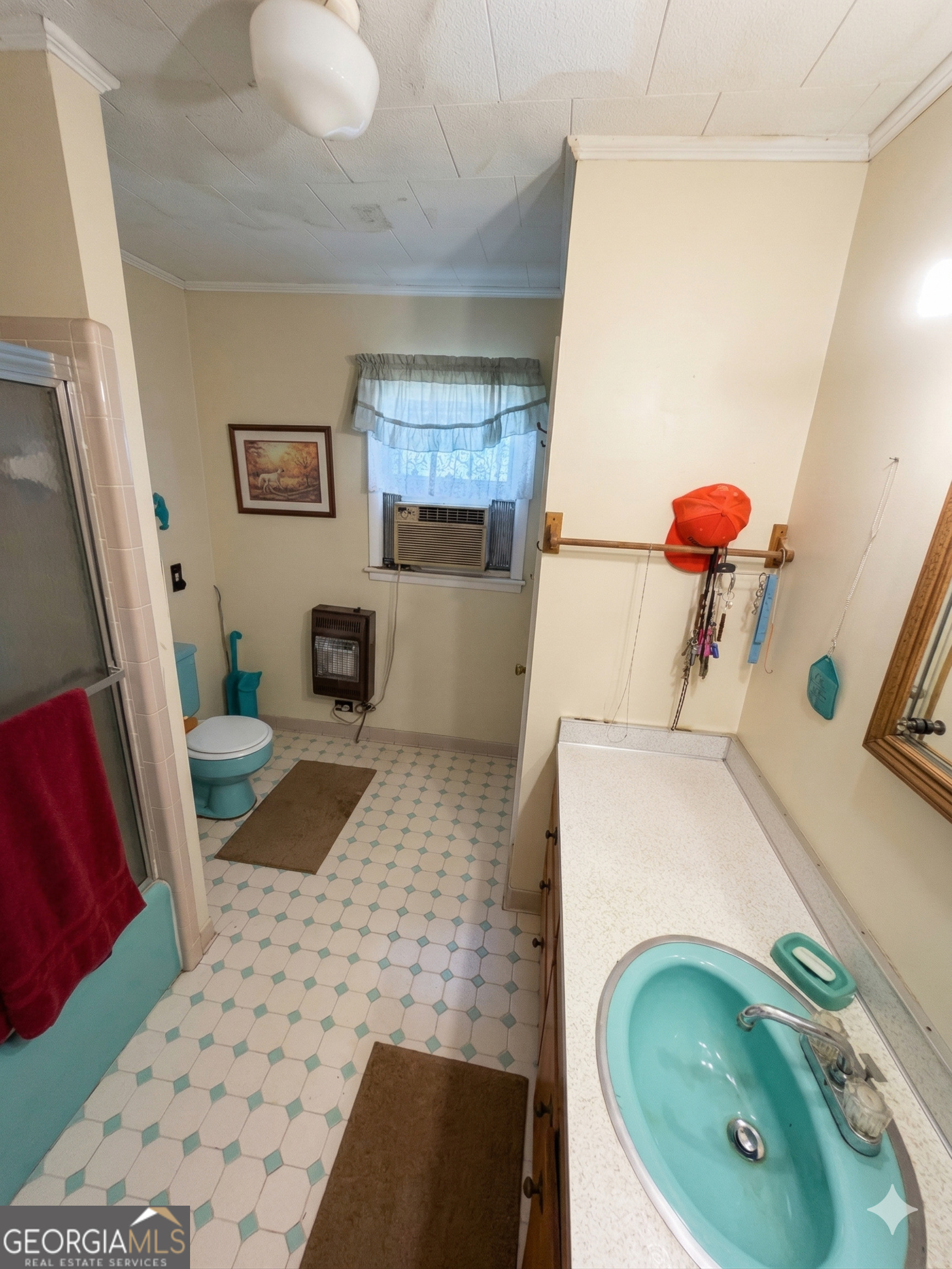 32737 Highway 48 Graham, AL 36263 - Photo 35 of 69 a bathroom with a sink mirror vanity and toilet